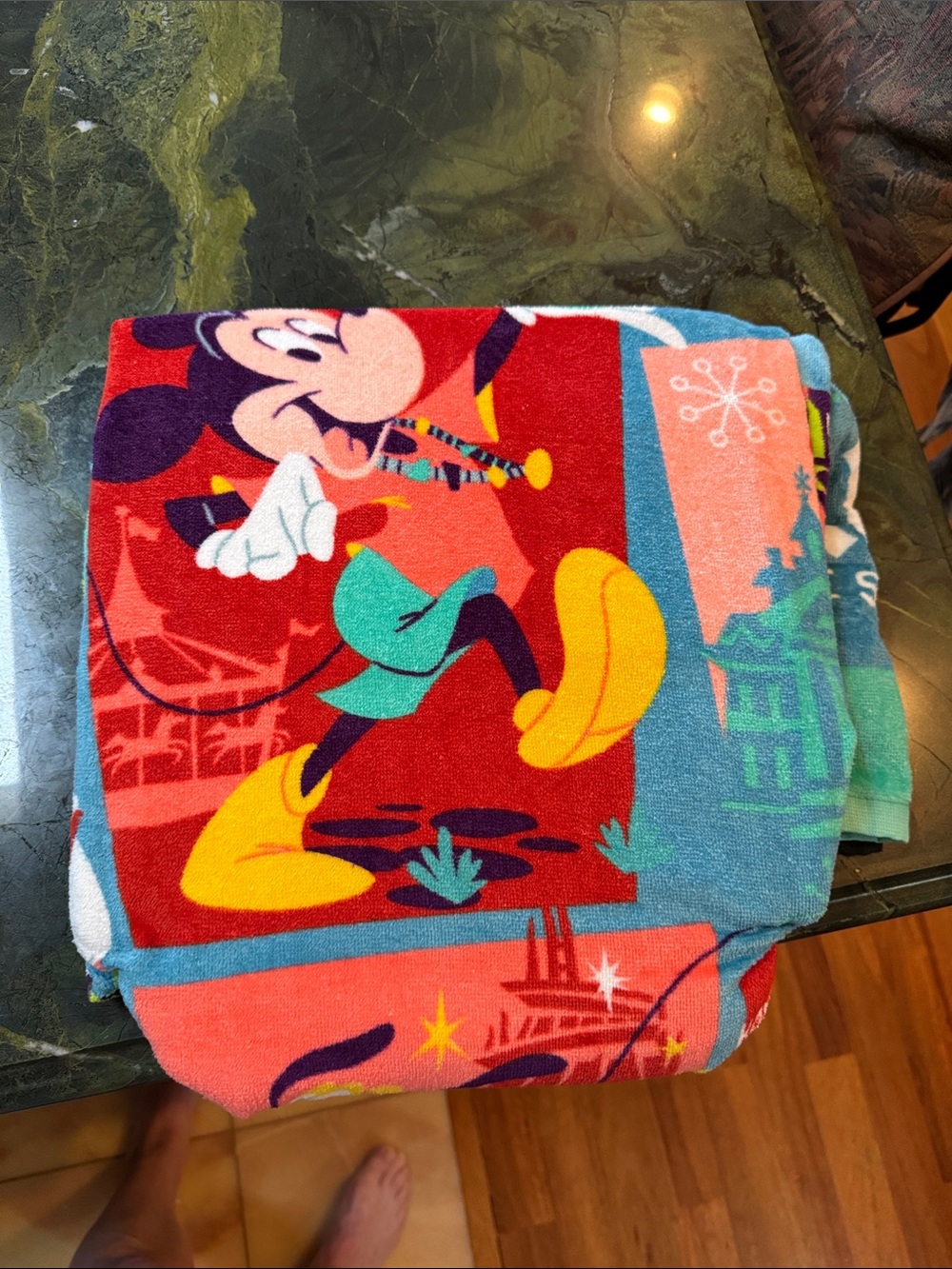 Disney Parks "Play in the Park" beach towel features a graphic of Mickey Mouse